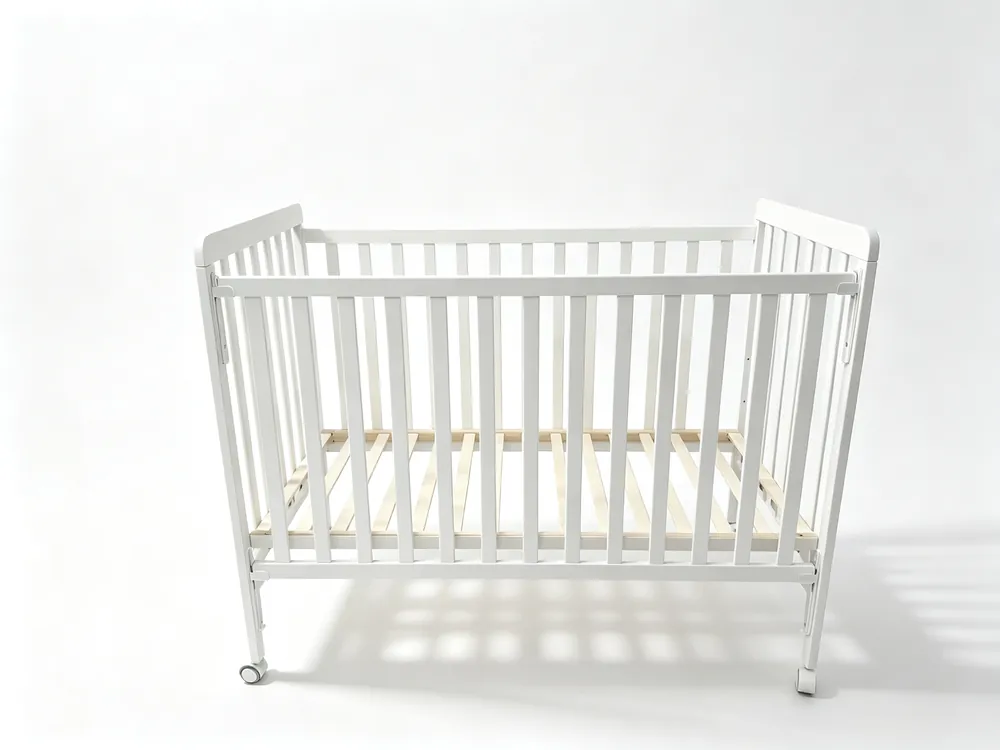 W25005 baby cot — side view, solid pine frame