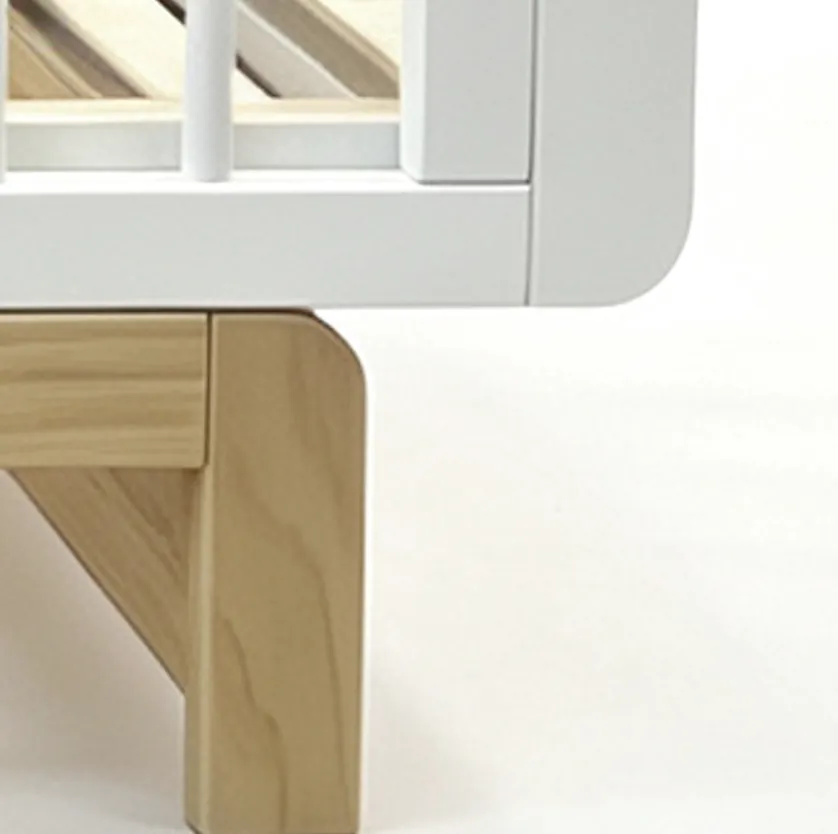 W26001 3-in-1 convertible baby cot — side view, solid pine frame